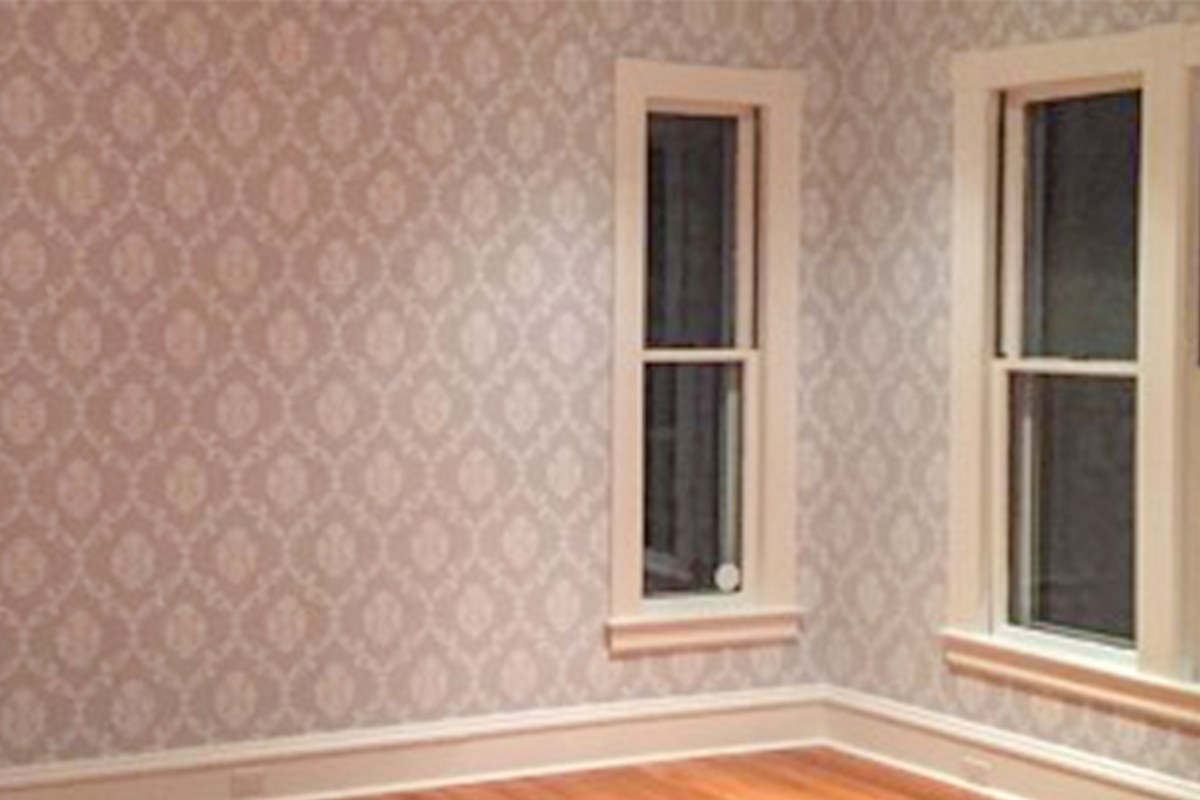 A room finished with elegant patterned wallpaper