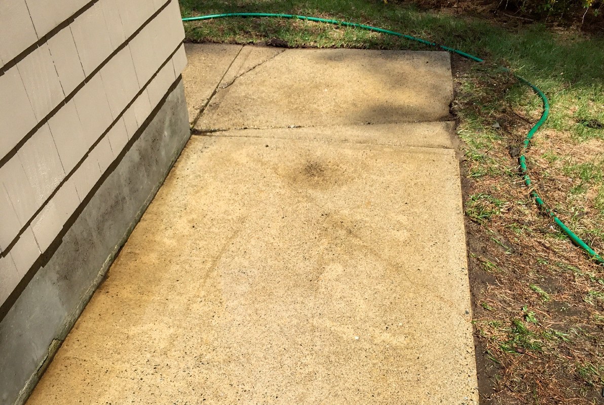 A concrete patio cleaned by power washing